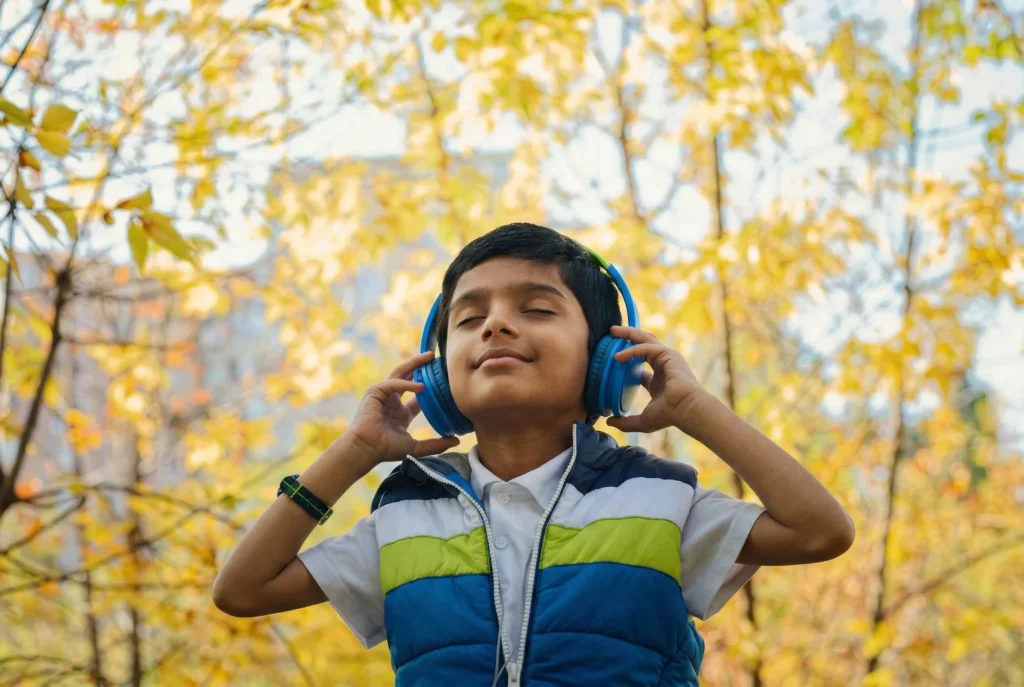 child headphone looking up Soul of Music